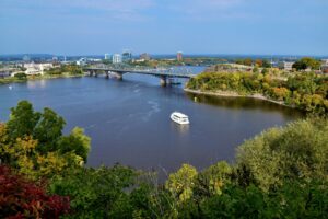 A view of Ottawa that includes the river and a bridge.